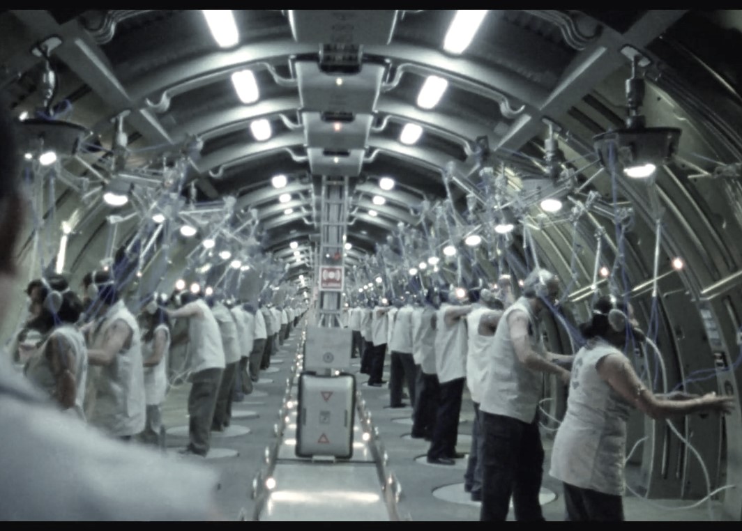 Image of node workers in a factory from the film Sleep Dealer by Alex Rivera